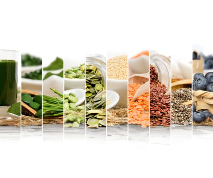 Strips of whole foods including green juice, pumpkin seeds, quinoa, red lentils, flaxseed, chia seeds and blueberries