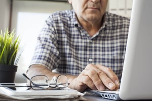 middle aged man using computer