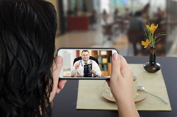 Women using telehealth on mobile