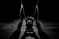 Person lifting a kettlebell 