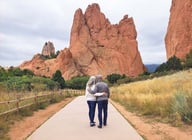 Man and his wife gazing over view of rock formations