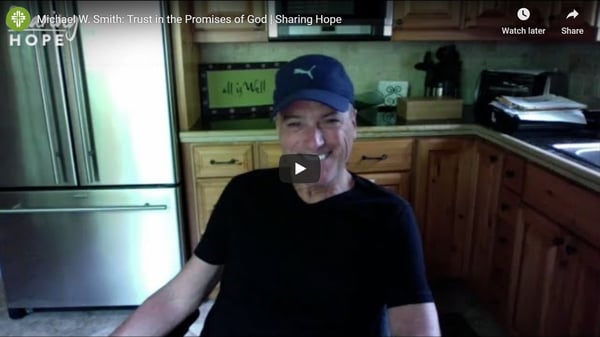 Michael W. Smith smiling in a kitchen in a still from the Sharing Hope video Trust in the Promises of God