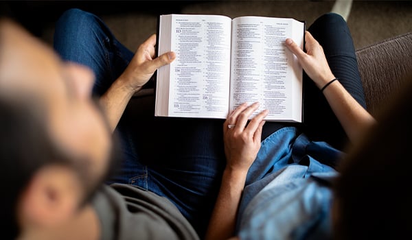 dad reading bible with son