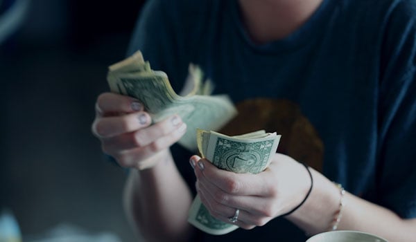 person counting cash