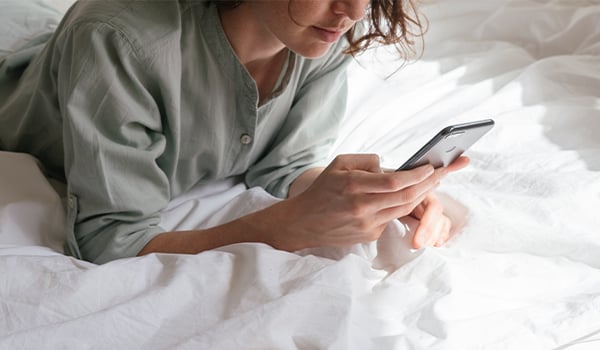 woman looking at phone