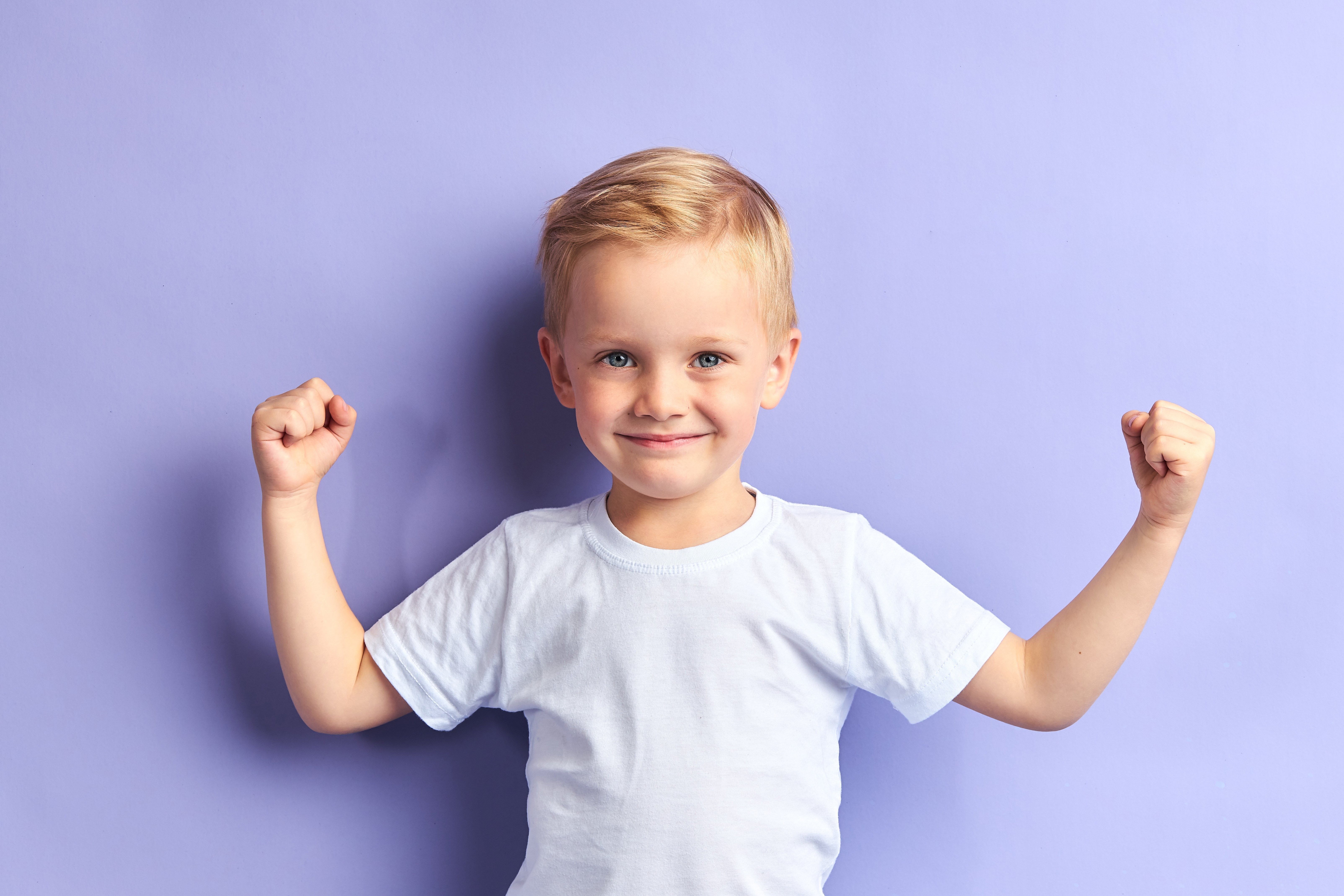 A young boy posing for a picture.