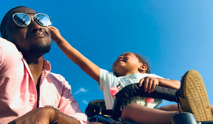 Daughter grabbing fathers sunglasses