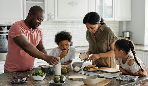 Family eating breakfast in the kitchen