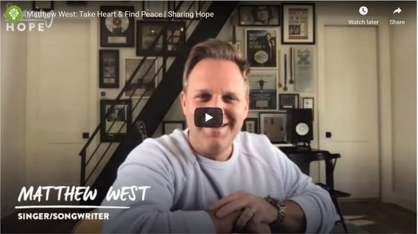Singer-songwriter Matthew West smiling in a still from the Sharing Hope video Take Heart and Find Peace