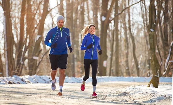 Couple running in cold weather