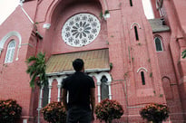 Man looking up at a church