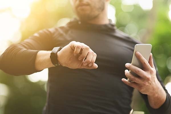 Man wearing fitness watch