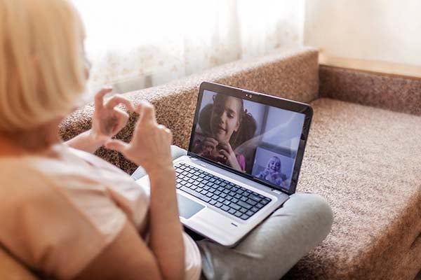 Grandma video chatting with granddaughter