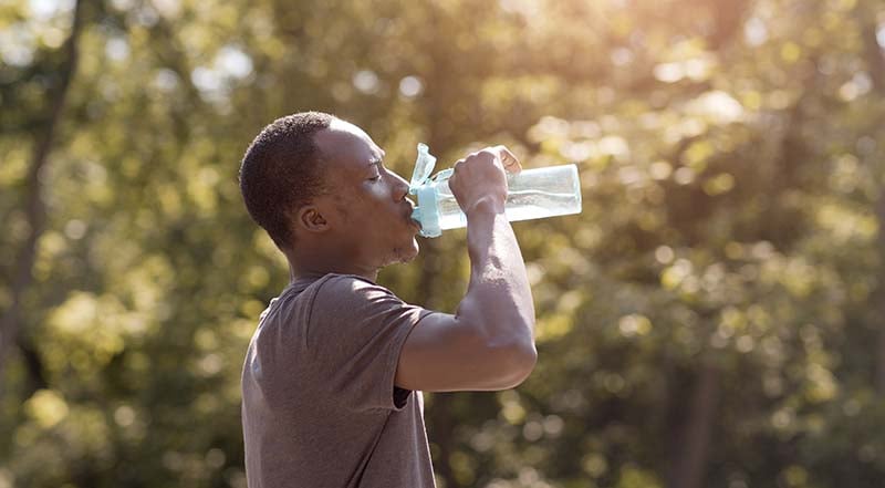 Man drinking water during a workout