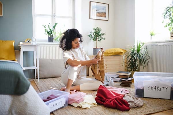 Woman decluttering clothes