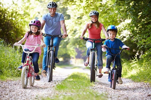 Family riding bikes together