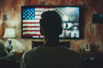 Man watching TV during the election