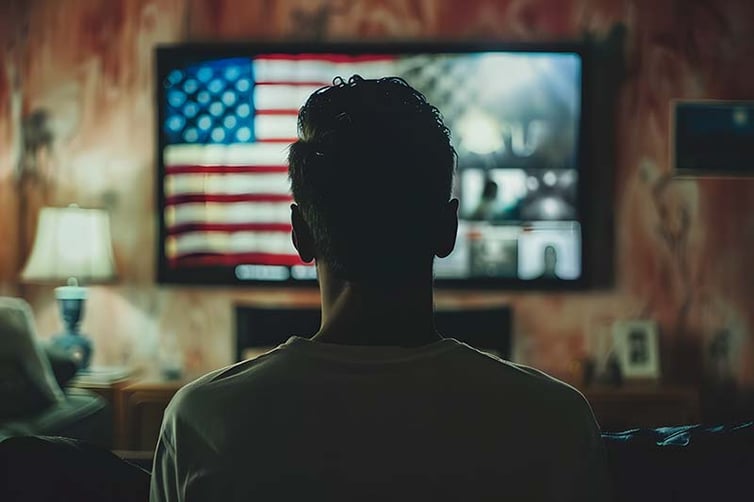 Man watching TV during the election
