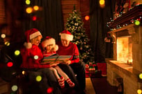 Family sitting and reading the Christmas story together