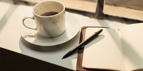 coffee cup and journal