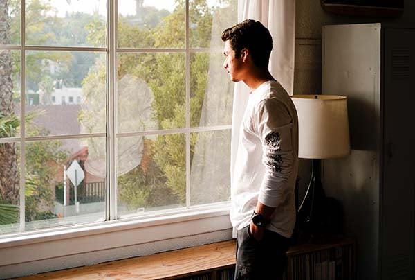 Man standing at window