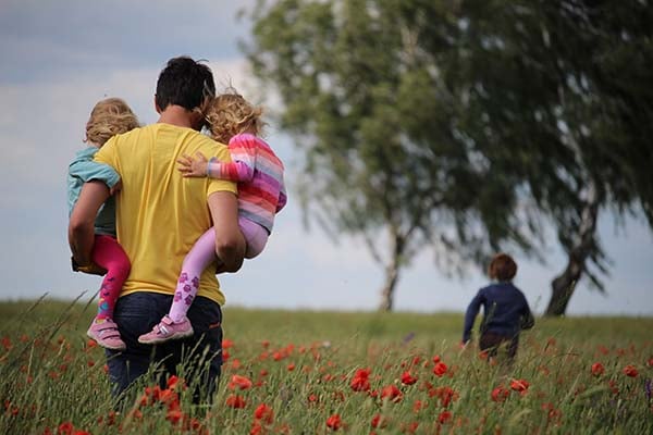 Man carrying children