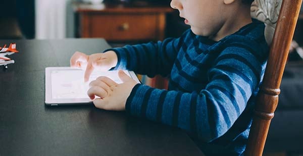 Boy playing on a tablet