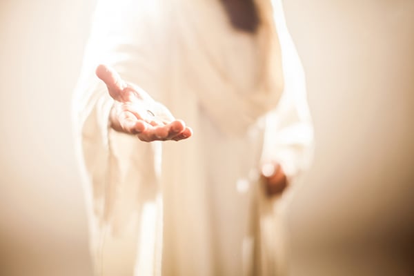 Jesus holding his hand out