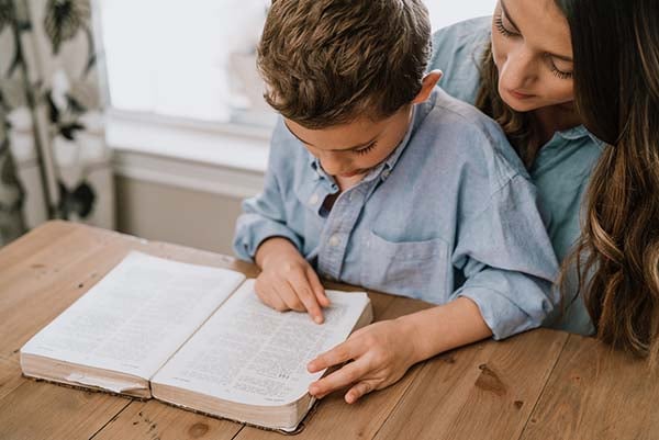 Mother and son reading the Bible