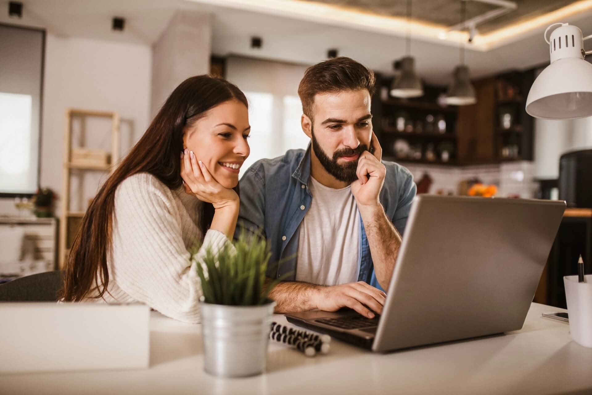 A couple reviewing healthcare costs on a laptop
