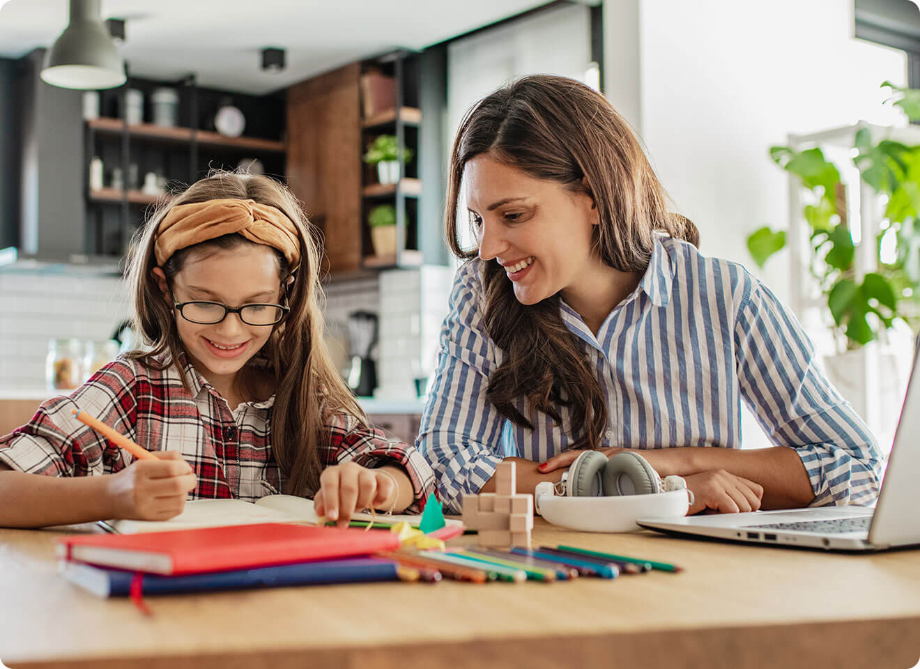 Mom and daughter enjoying home school lessons with peace of mind from their health care sharing ministry.