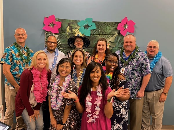 Christian Care Ministry finance team dressed in a Hawaiian theme
