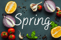 'Spring' written over fruits and vegetables