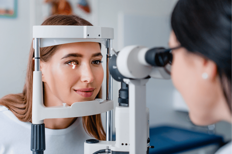 woman getting her eye examined by an eye doctor