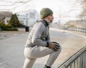Man warming up to run outside