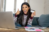 smiling young woman following financial advice for young adults