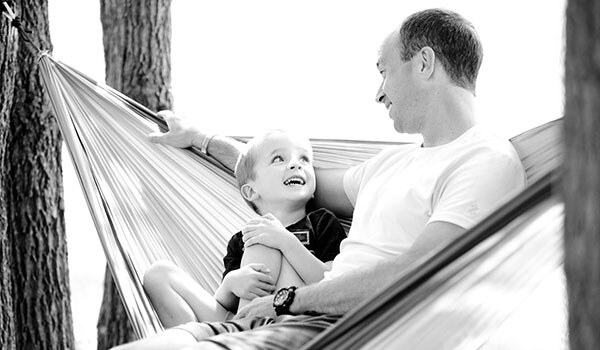 boy looking up to dad