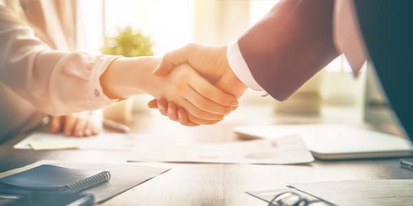business handshake after deal