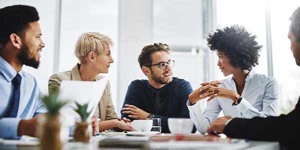 coworkers talking at a table