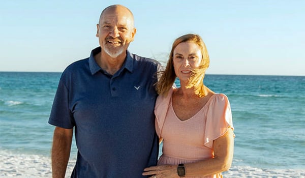 Darrel and Rose smiling together on the beach