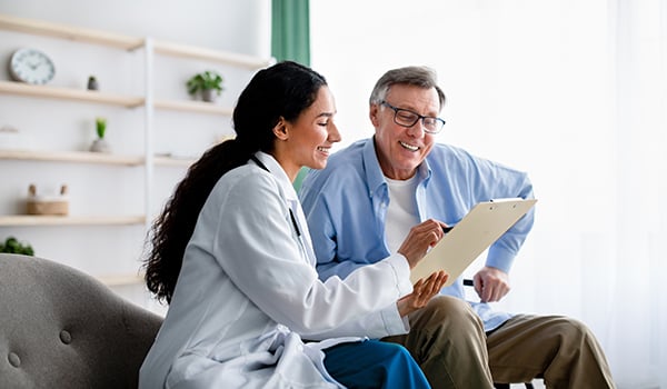 doctor explaining document to patient
