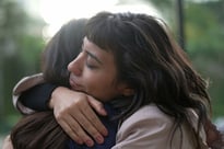 Sympathetic woman hugging friend with empathy and support
