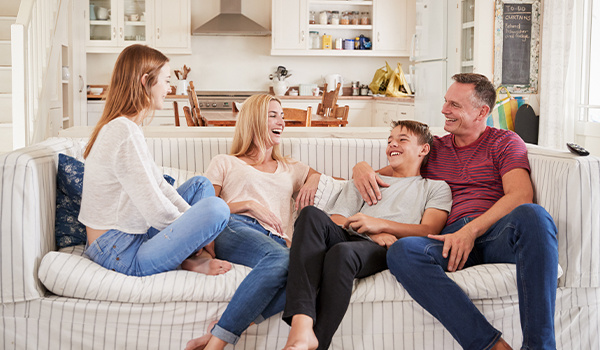 Family sitting together, laughing
