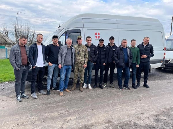 group of men with young soldier - ukraine