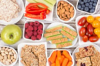a selection of healthy snacks, fruits, and vegetables