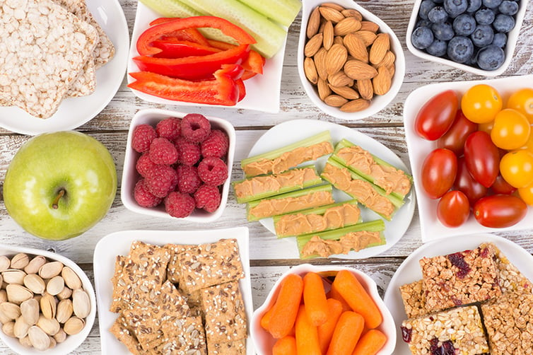 a selection of healthy snacks, fruits, and vegetables