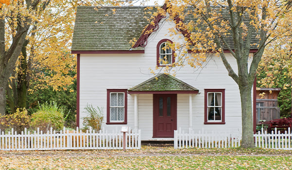 house with fall leaves