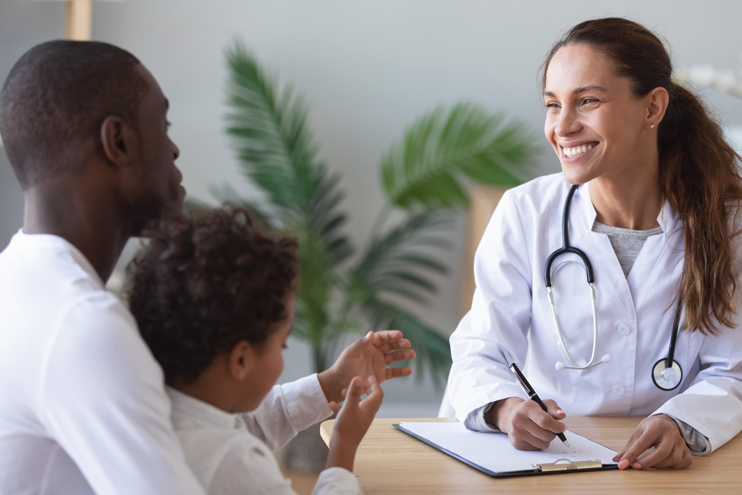 A father and son meeting with their doctor