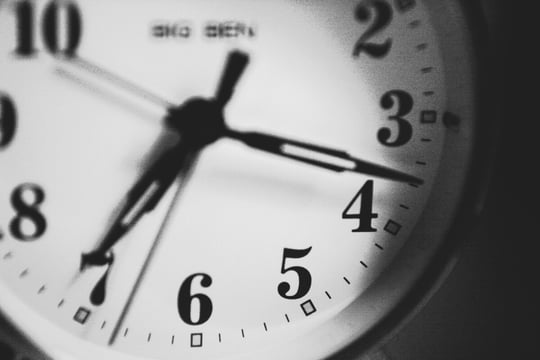 Black-and-white close-up of an analog clock face