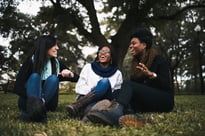 Friends laughing in the park